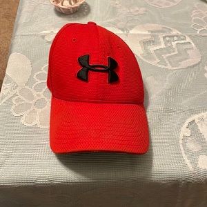 New red mens under armour hat with under armour logo on front and back